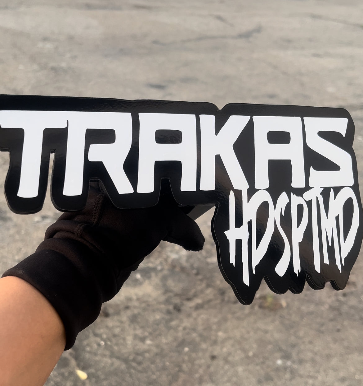 TRAKAS (white lettering)