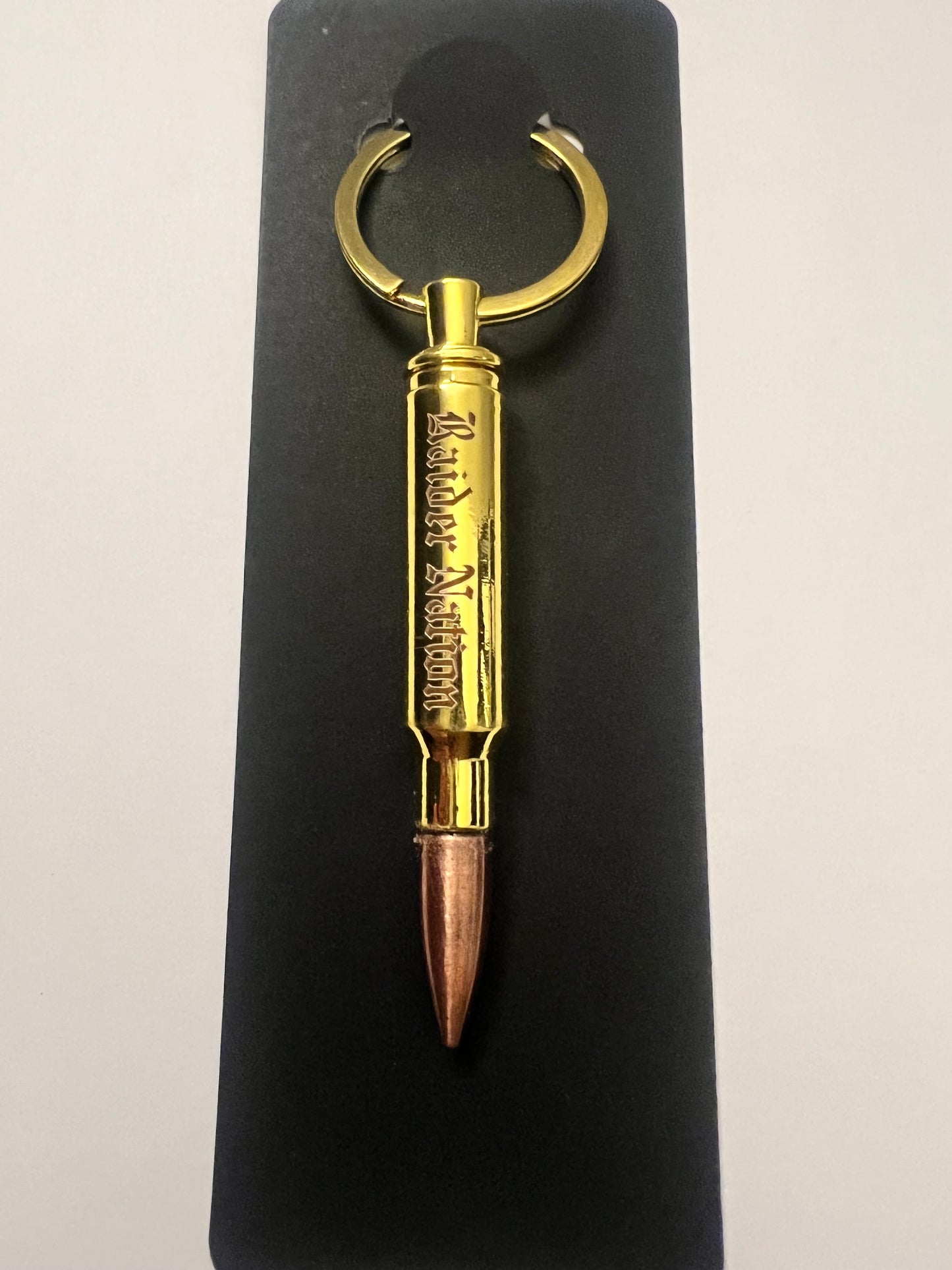 Raider nation bullet bottle opener keychain