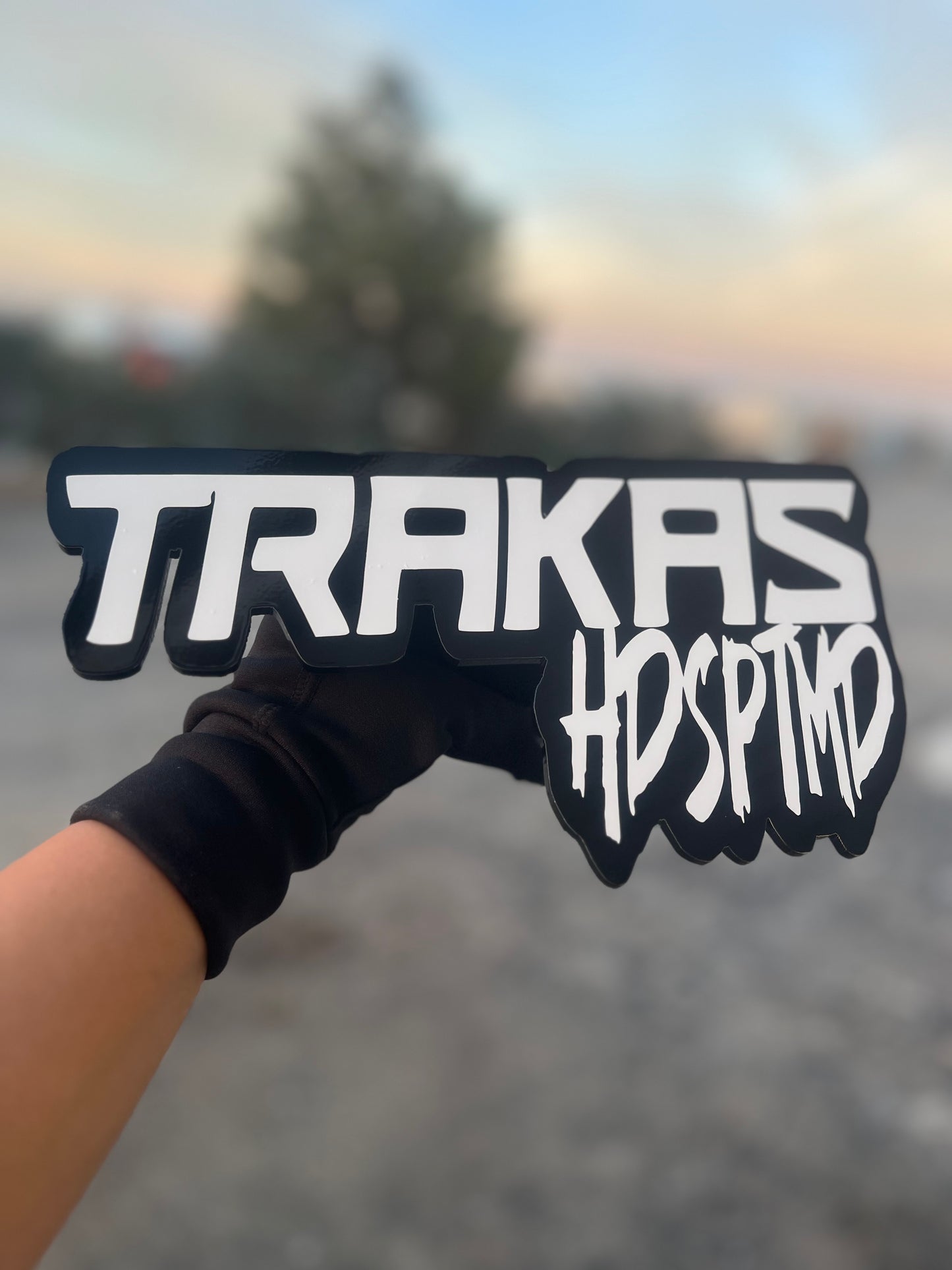 TRAKAS (white lettering)