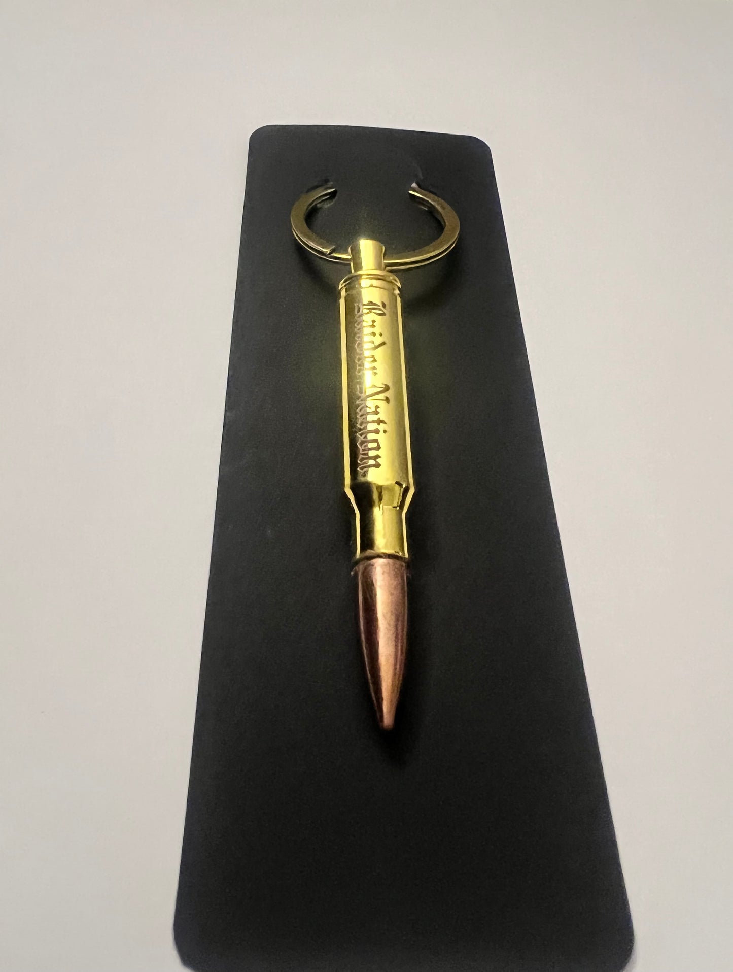 Raider nation bullet bottle opener keychain